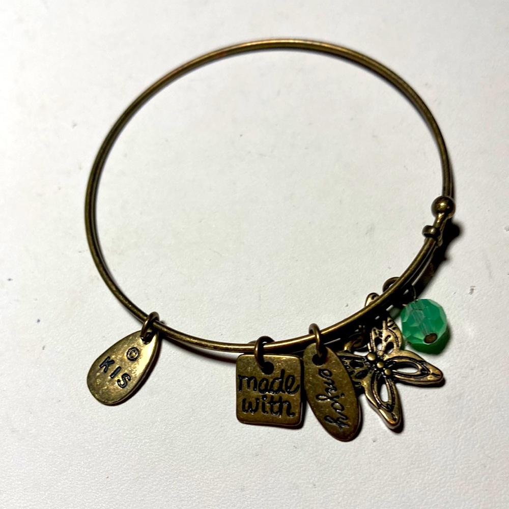 Bangle bracelet in brass with green bead and butterfly.  #1823